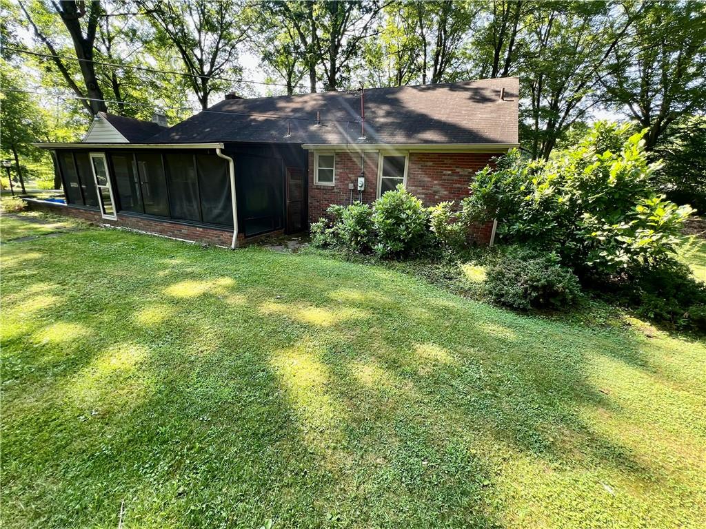 963 Kings Chapel Road New Castle, PA 16105 - Photo 5 of 27 a front view of a house with a garden
