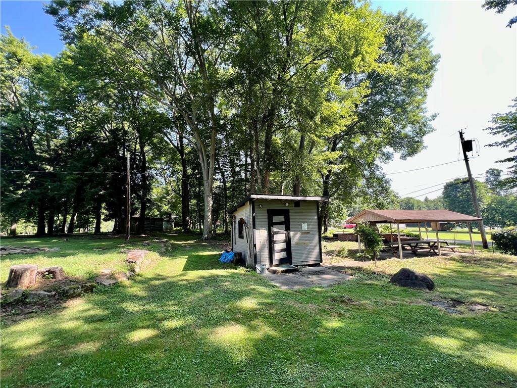 963 Kings Chapel Road New Castle, PA 16105 - Photo 9 of 27 a view of a house with a yard porch and sitting area