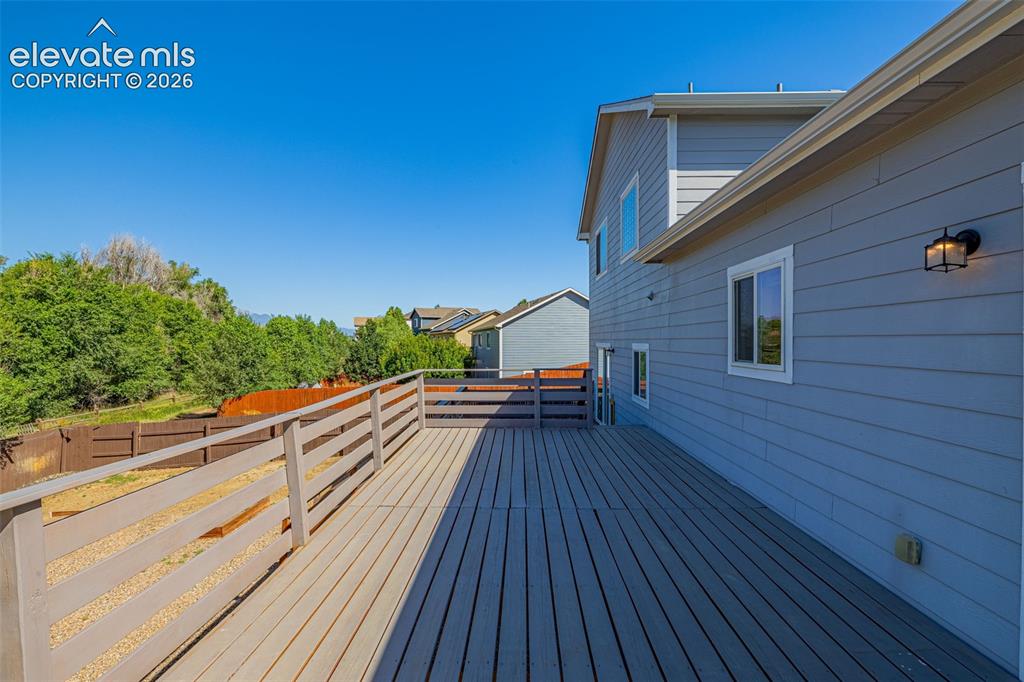 11185 Falling Star Road Fountain, CO 80817 - Photo 28 of 46 a view of balcony with wooden floor and fence