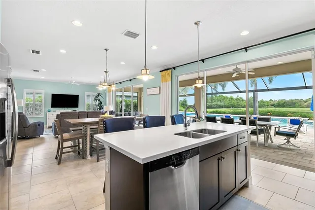 a kitchen that has a lot of cabinets in it