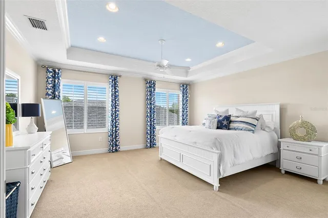 a spacious bedroom with a bed and a window