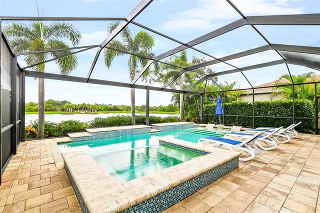 a view of swimming pool with a patio