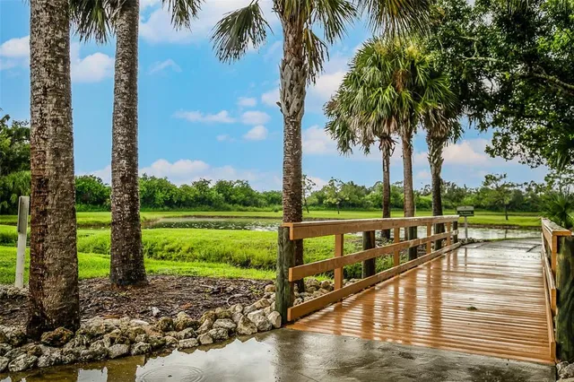 a view of swimming pool with a table and chairs
