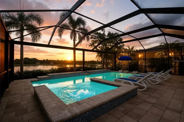 a view of a swimming pool with a patio