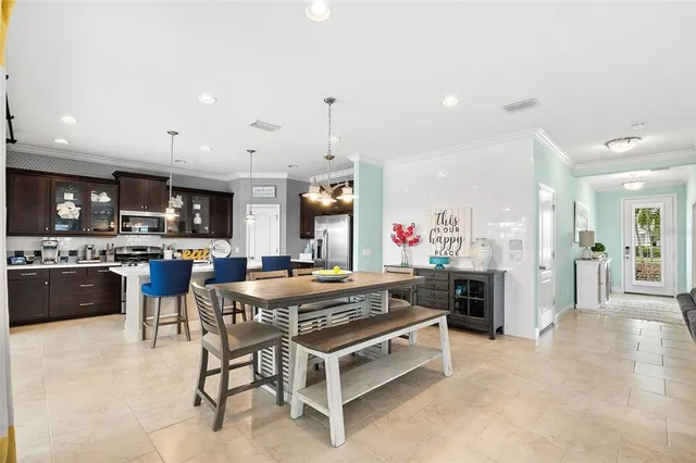 a kitchen with a table and chairs in it