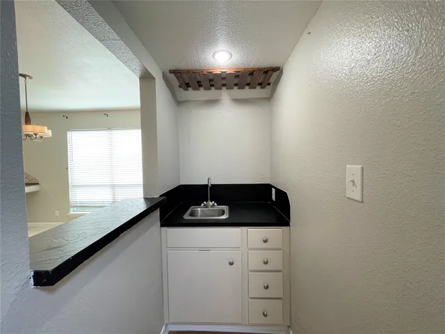 a view of room with window and wooden floor