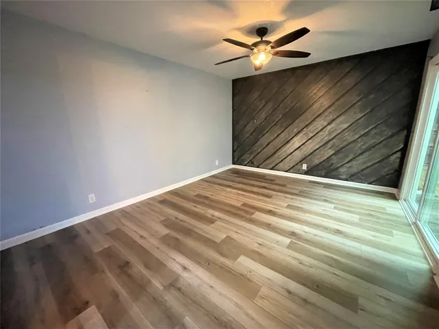 a bathroom with a granite countertop toilet sink and a mirror