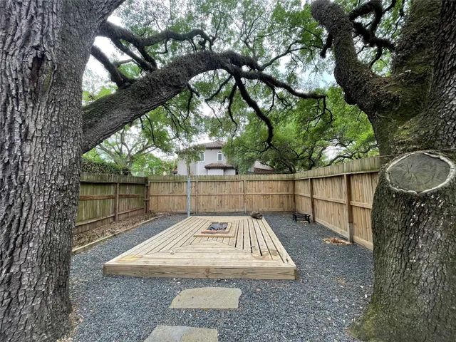 a view of a pathway with a backyard