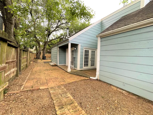 a kitchen with granite countertop a sink stainless steel appliances and cabinets
