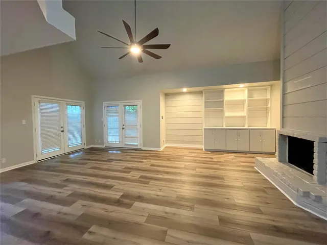 a bathroom with a shower and a glass door