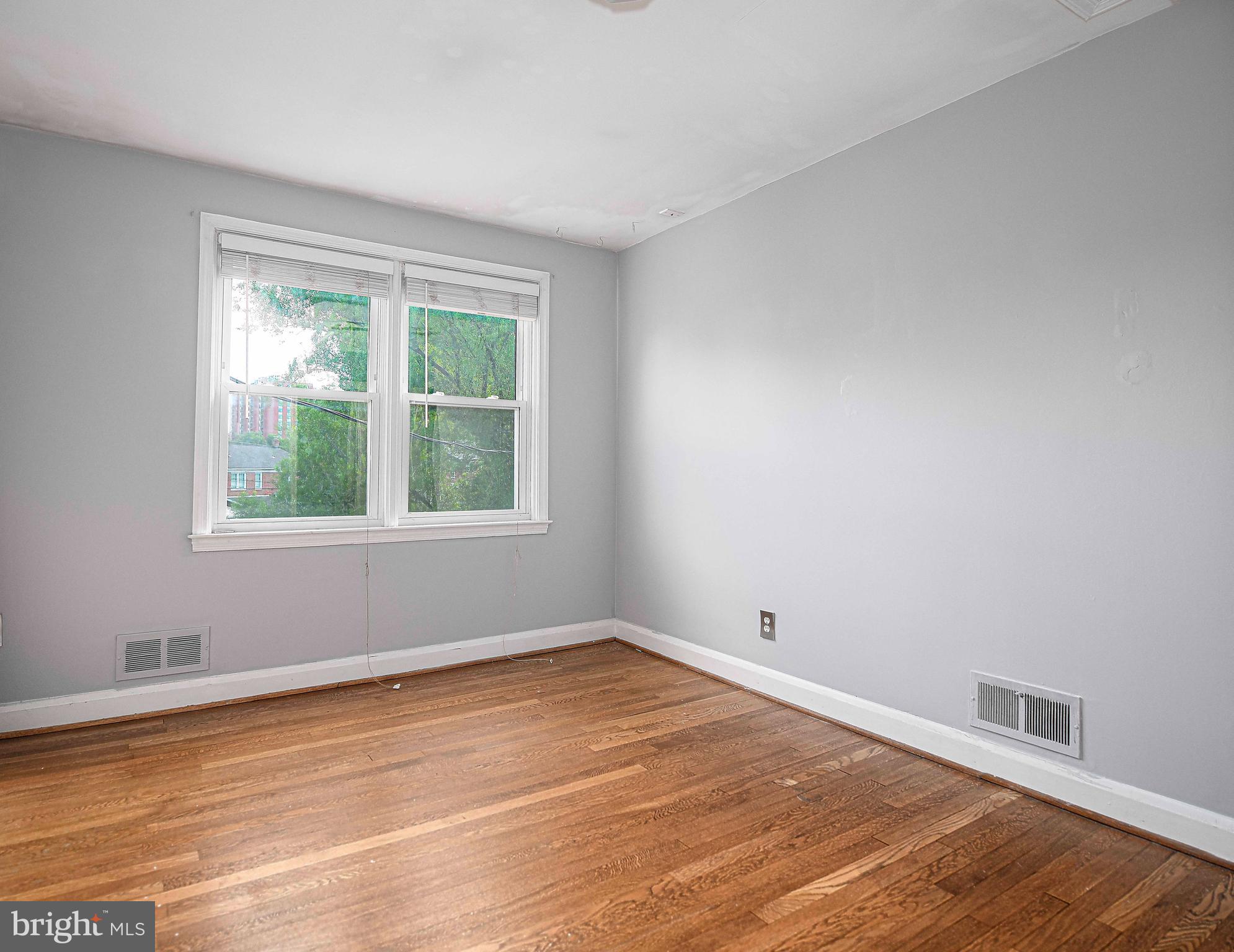 967 Radcliffe Road Baltimore, MD 21204 - Photo 16 of 26 a view of empty room with wooden floor and fan