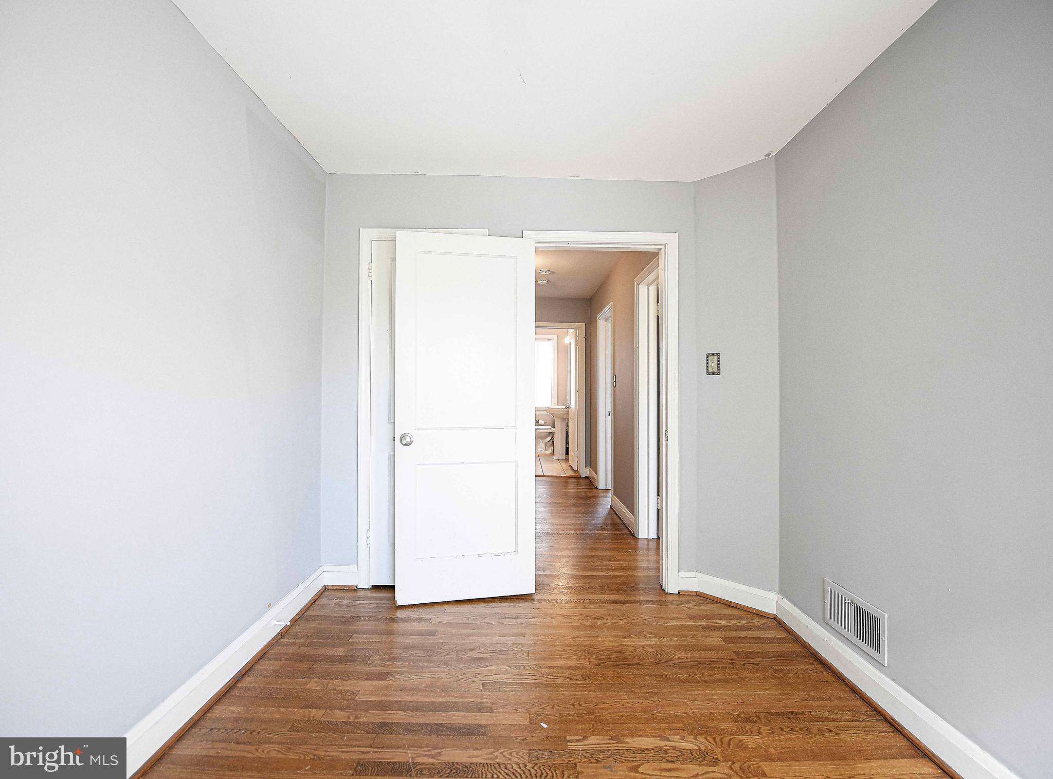 967 Radcliffe Road Baltimore, MD 21204 - Photo 18 of 26 a view of an empty room and wooden floor