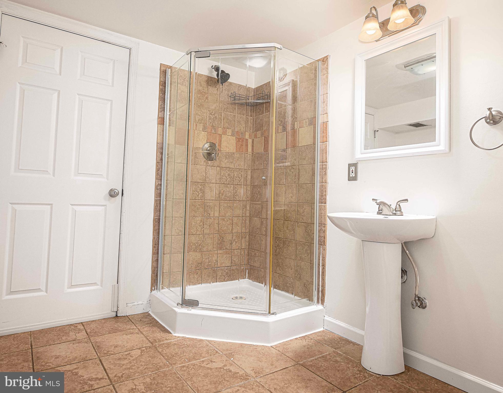 967 Radcliffe Road Baltimore, MD 21204 - Photo 21 of 26 a bathroom with a shower and a sink