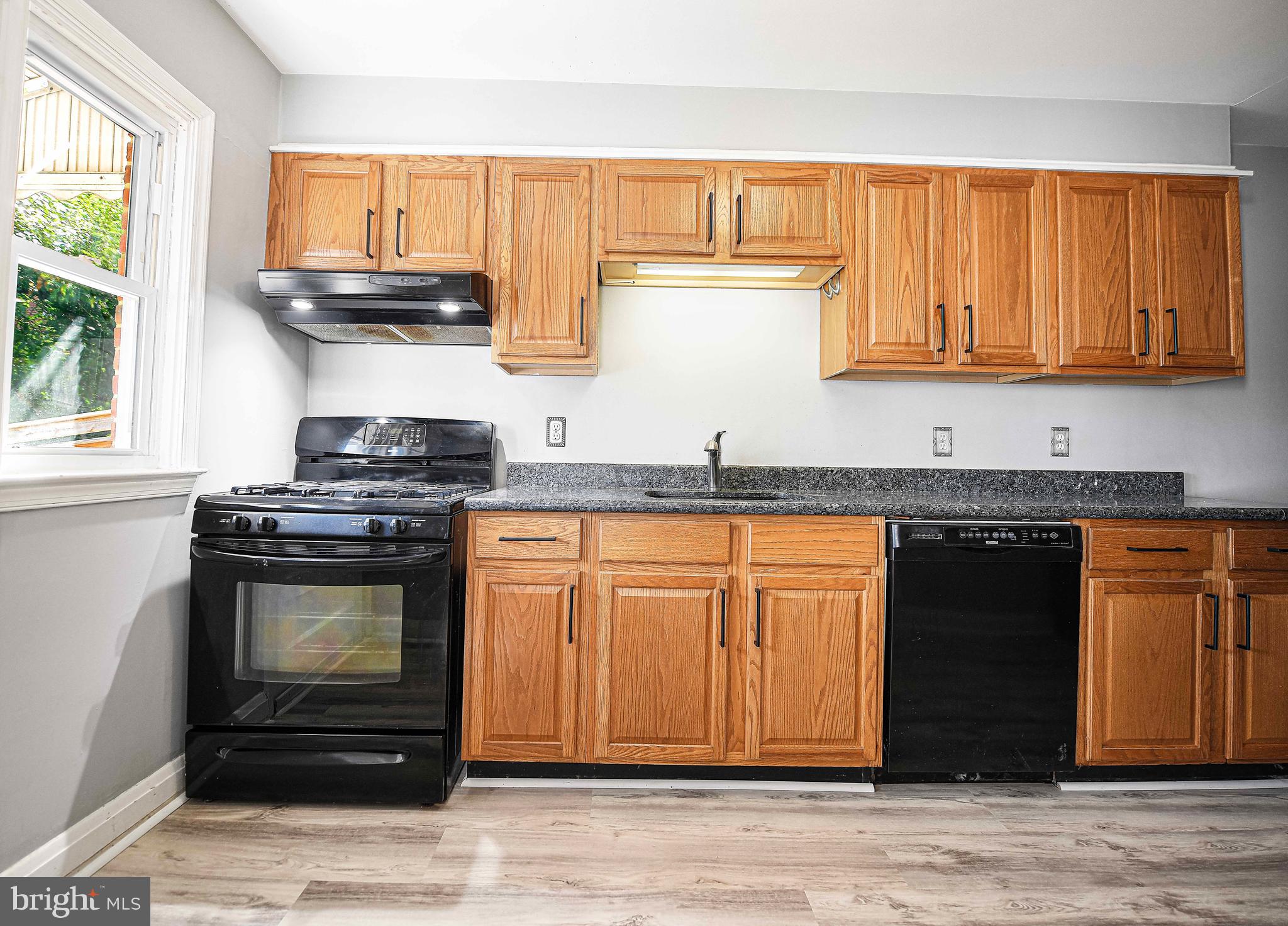 967 Radcliffe Road Baltimore, MD 21204 - Photo 10 of 26 a kitchen with granite countertop cabinets stainless steel appliances and a sink