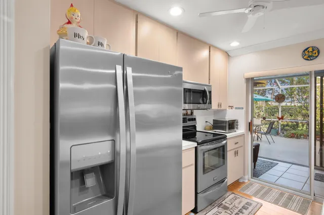 a kitchen with a refrigerator and a stove