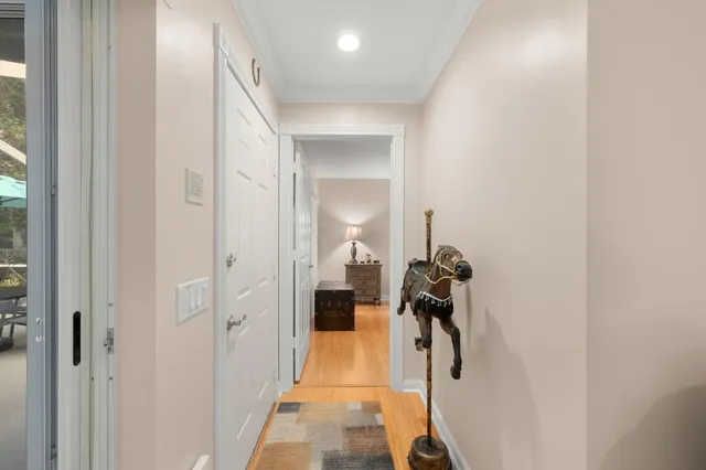 a view of a hallway with a chair