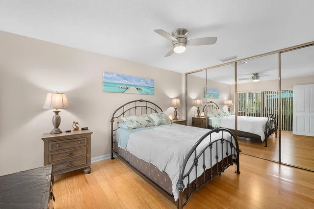 a bedroom with a bed a couch and dresser