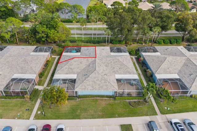 an aerial view of a house with a swimming pool