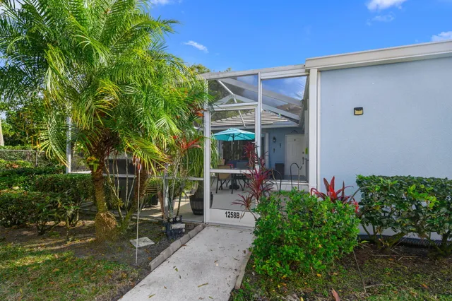a view of house with patio outdoor seating