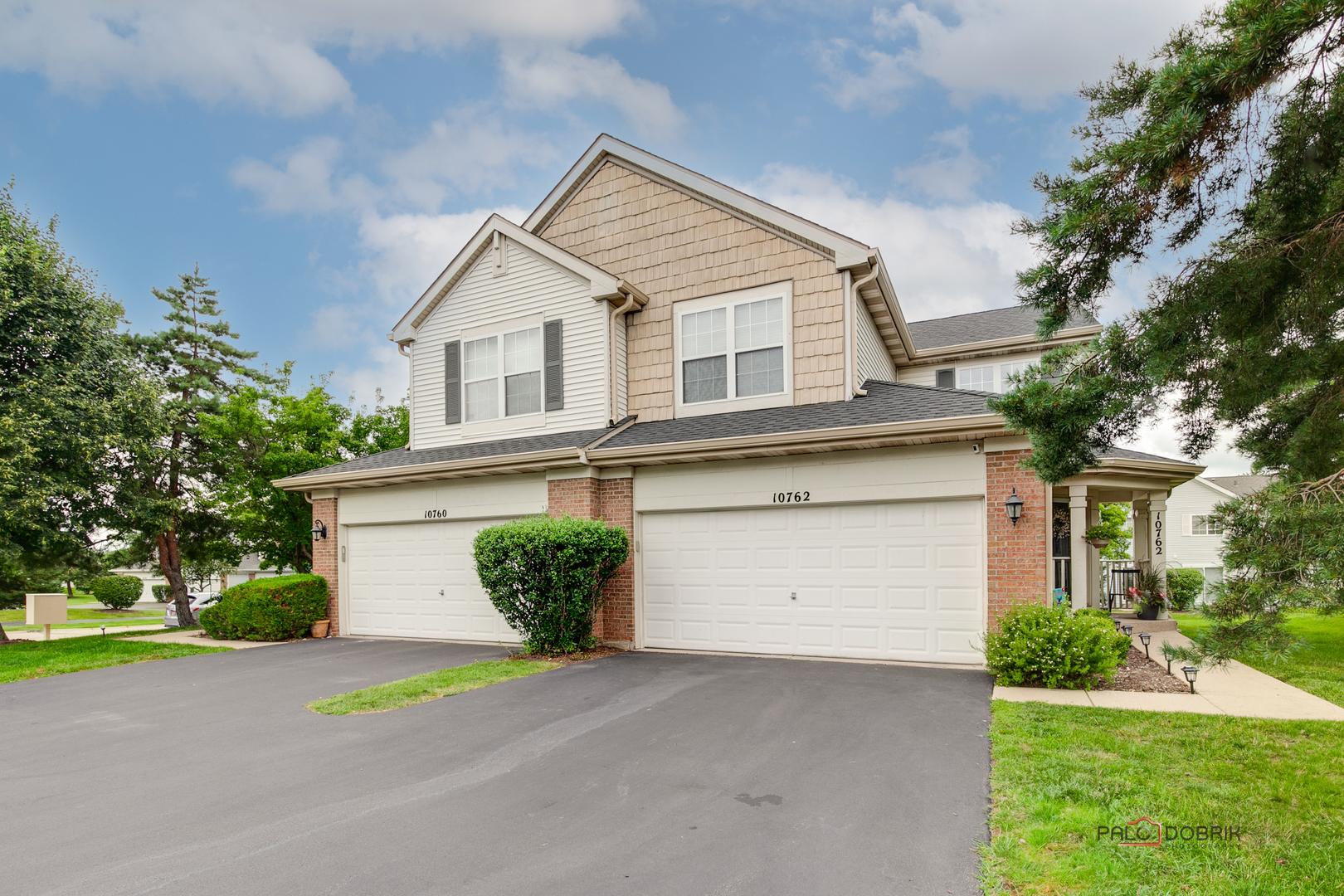 10762 Cape Cod Lane Huntley, IL 60142 - Photo 1 of 1 a front view of a house with a yard and garage