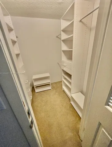 a view of an empty walk in closet