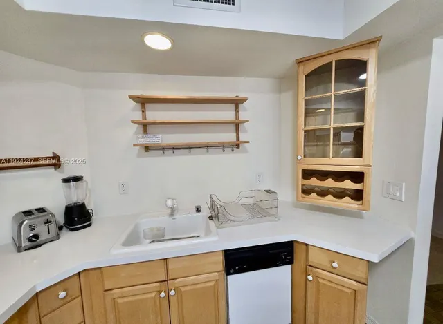 a kitchen with a cabinets and window