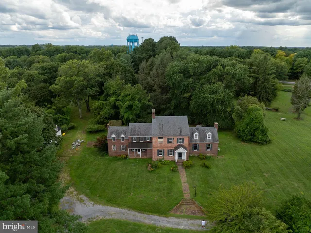 a view of a chairs in a big yard