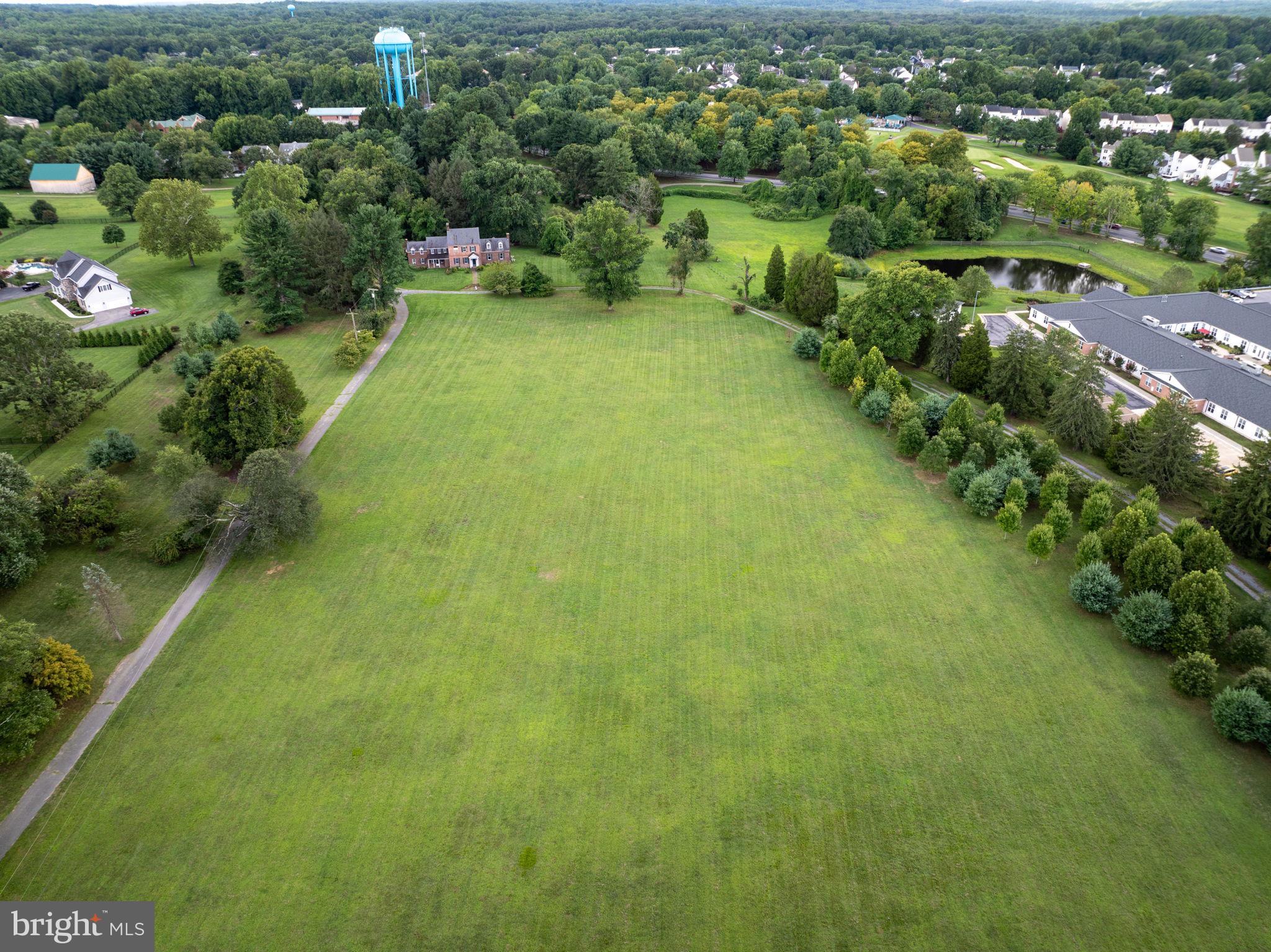 2173 Johns Hopkins Road Gambrills, MD 21054 - Photo 5 of 18 an aerial view of residential houses with outdoor space and trees