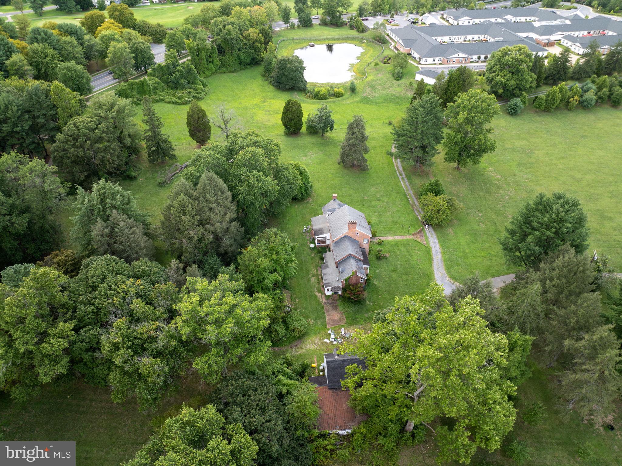 2173 Johns Hopkins Road Gambrills, MD 21054 - Photo 9 of 18 a backyard of a house with a yard and outdoor seating