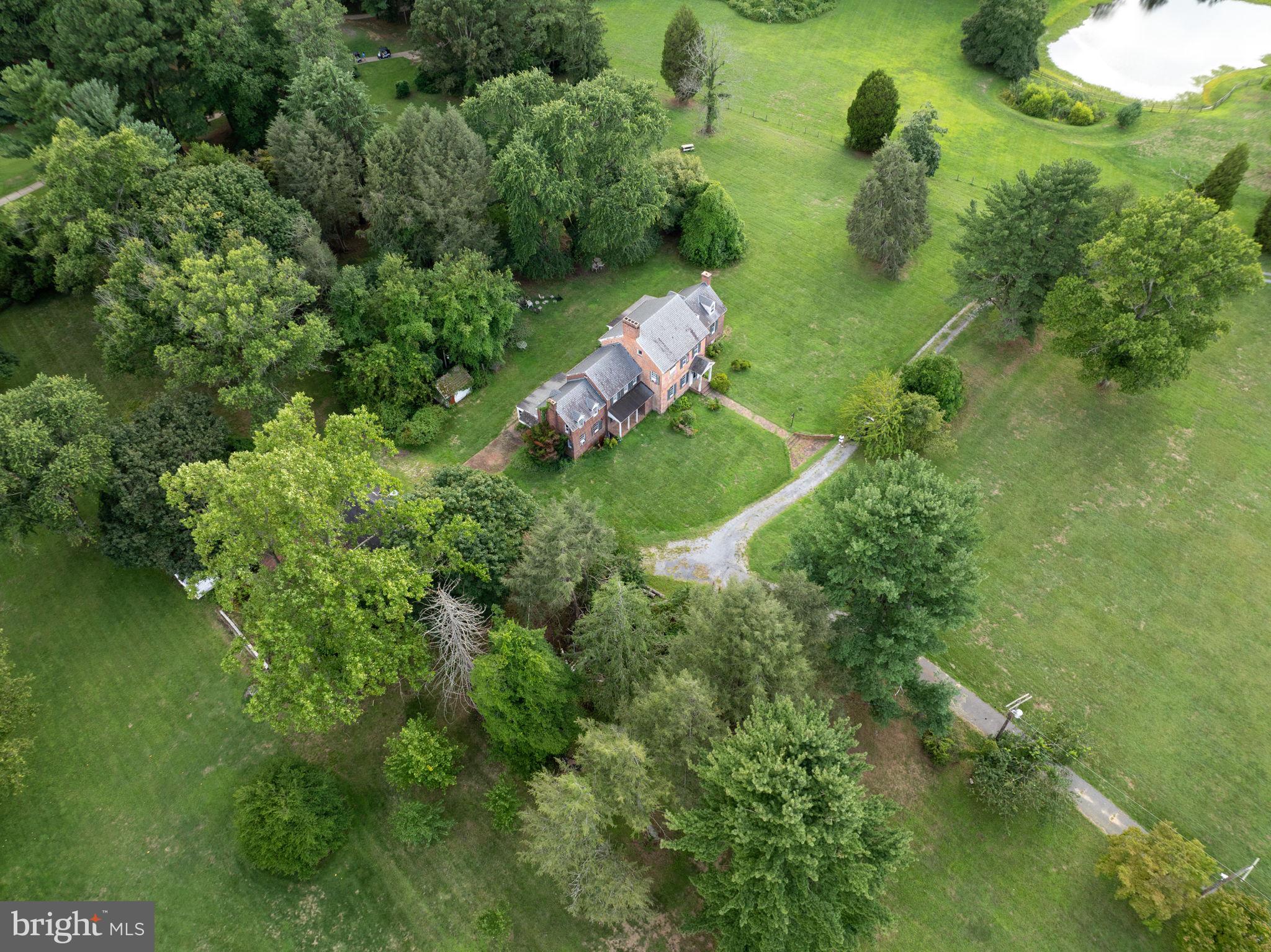 2173 Johns Hopkins Road Gambrills, MD 21054 - Photo 10 of 18 an aerial view of residential houses with outdoor space and trees all around
