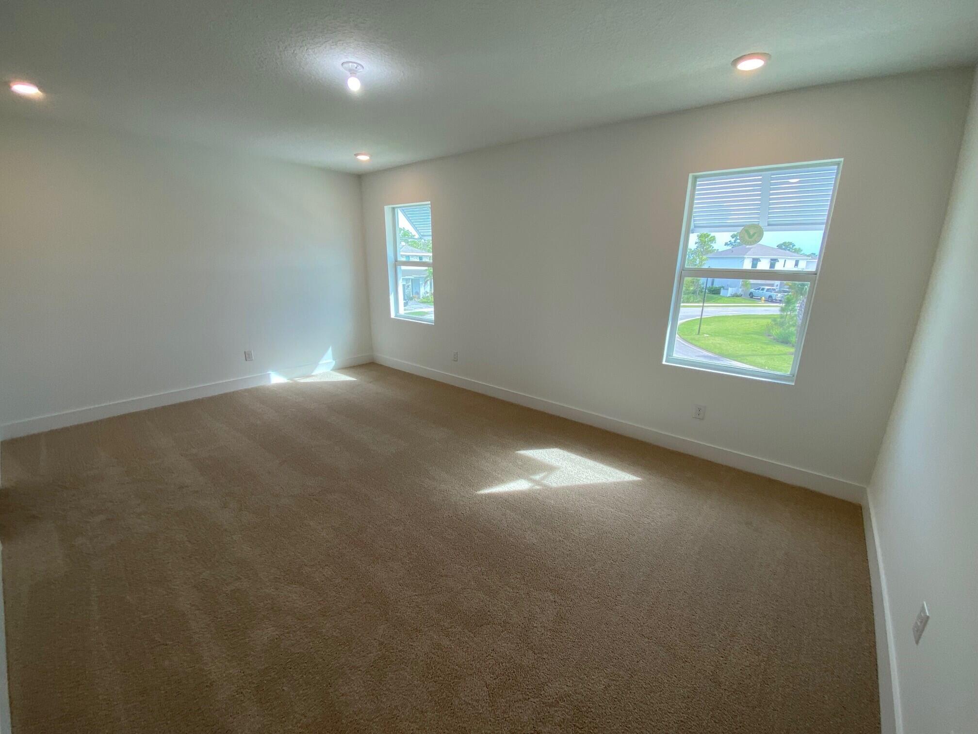 7011 Southeast Park Trace Drive Stuart, FL 34997 - Photo 15 of 19 an empty room with windows and closet