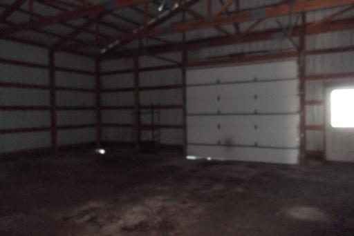 1279 Locust Road Lee, IL 60530 - Photo 6 of 14 a view of a room with wooden shelves and empty shelves