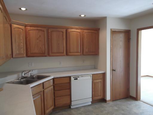 1279 Locust Road Lee, IL 60530 - Photo 9 of 14 a kitchen with a sink cabinets and appliances