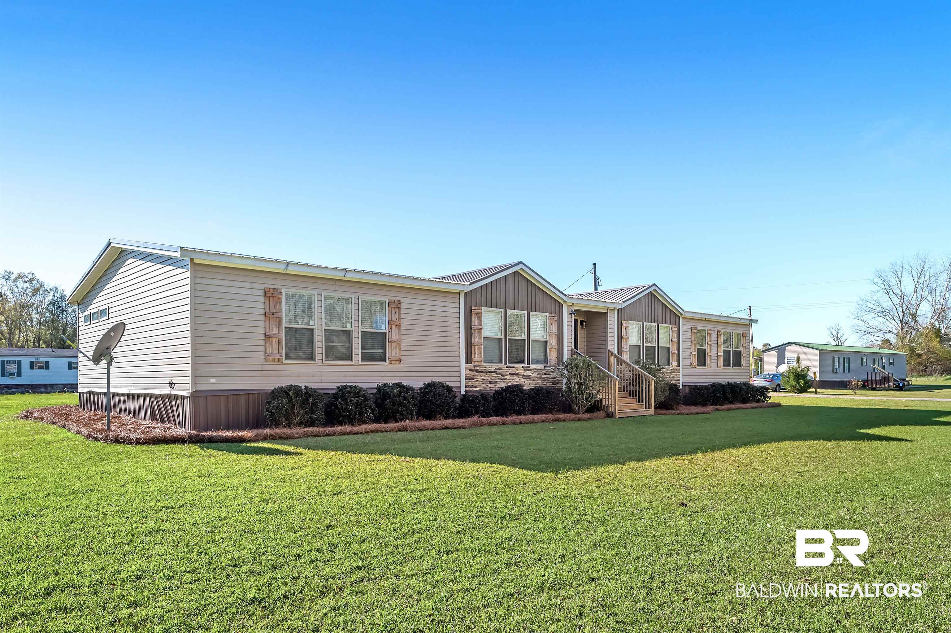 23233 Forland Road Silverhill, AL 36576 - Photo 2 of 33 Manufactured / mobile home featuring a front yard