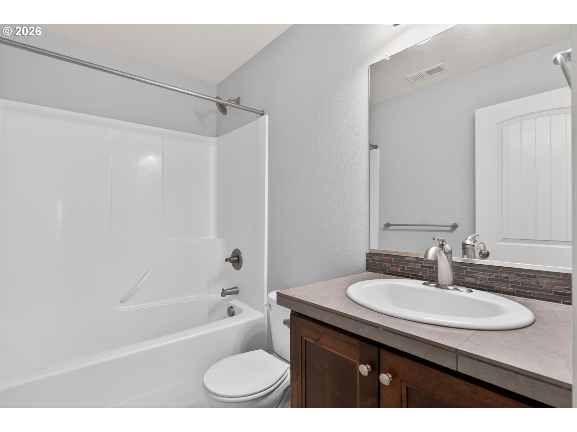 410 Rentfro Way Newberg, OR 97132 - Photo 20 of 39 a bathroom with a granite countertop sink shower bathtub and a toilet