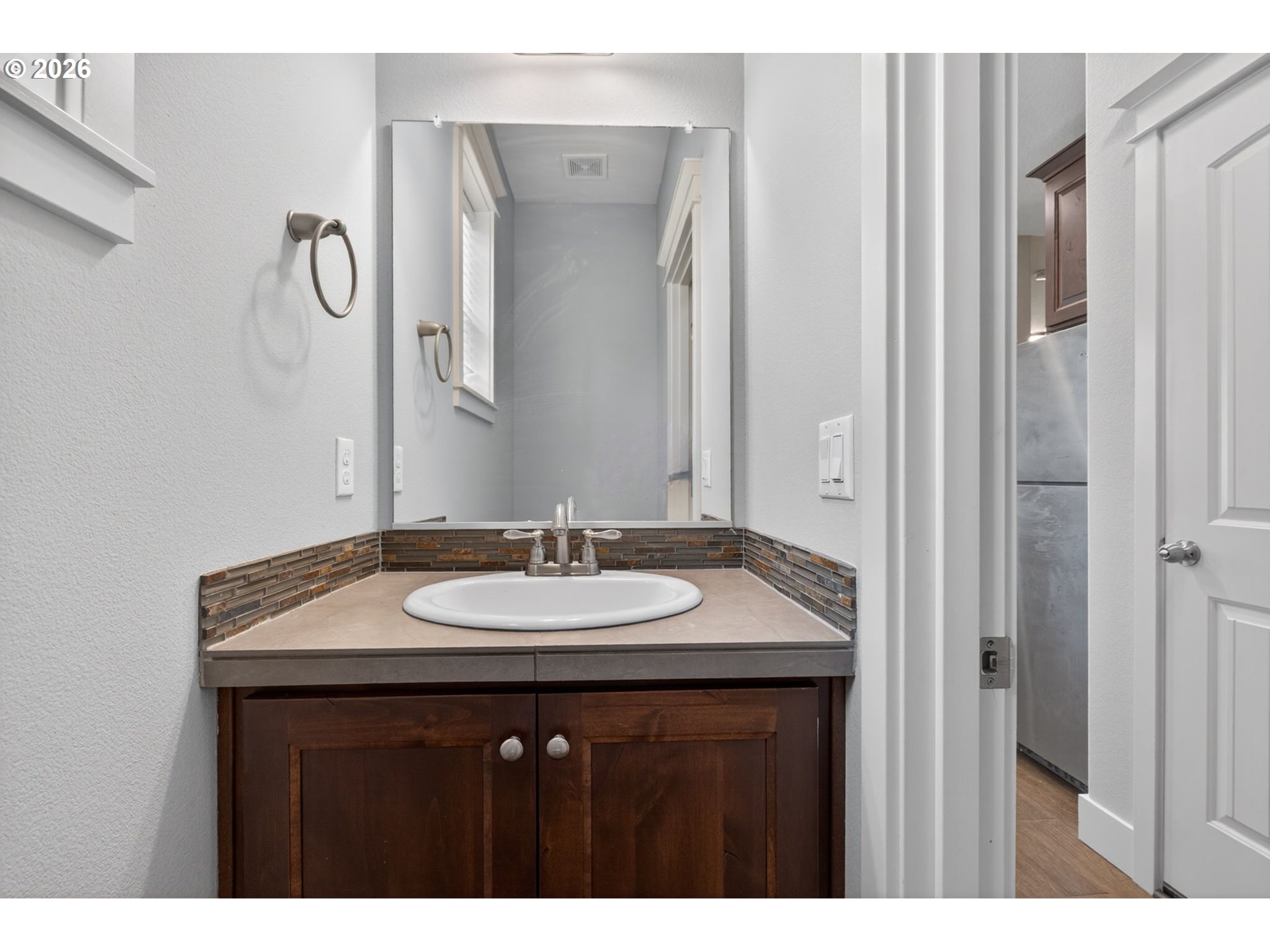 410 Rentfro Way Newberg, OR 97132 - Photo 26 of 39 a bathroom with a granite countertop sink and a mirror