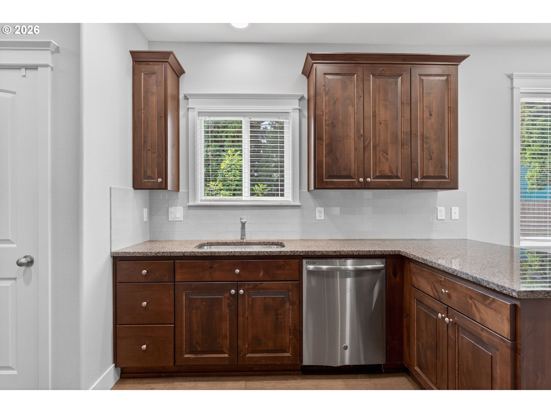 410 Rentfro Way Newberg, OR 97132 - Photo 10 of 39 a kitchen with a sink window and cabinets