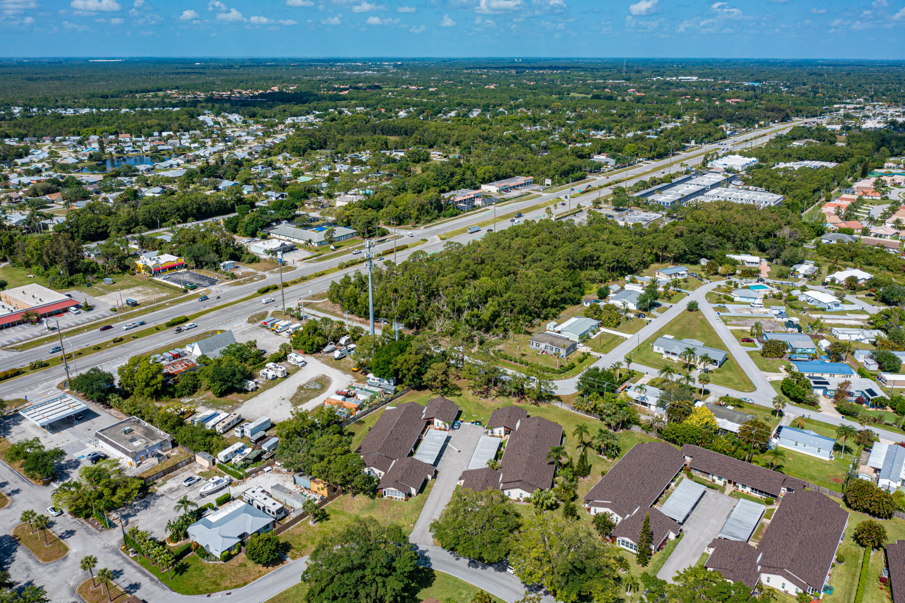 an aerial view of residential houses with outdoor space