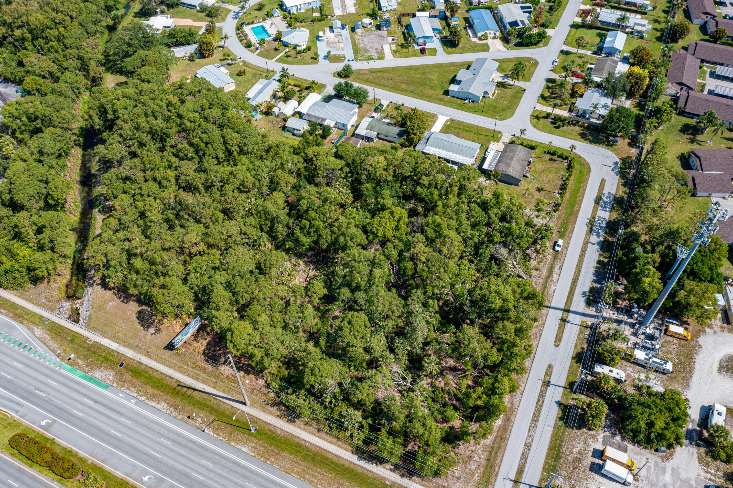 0 Southwest Federal Highway Stuart, FL 34994 - Photo 19 of 26 a picture of a tree with a wooden fence