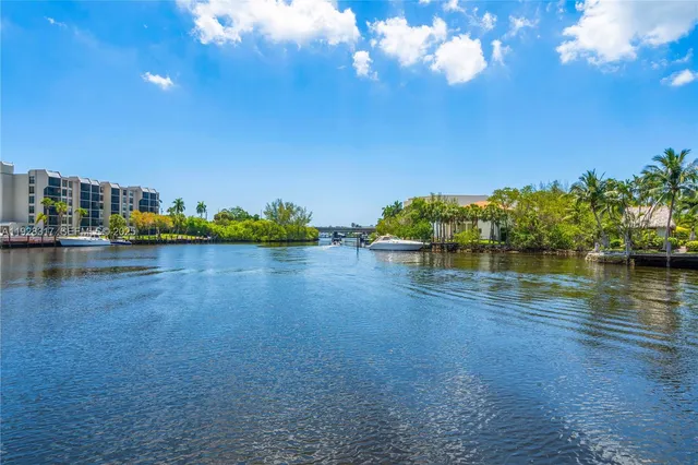 a view of a swimming pool with outdoor seating