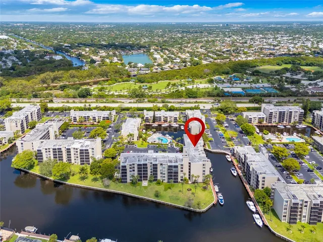 an aerial view of residential houses with outdoor space