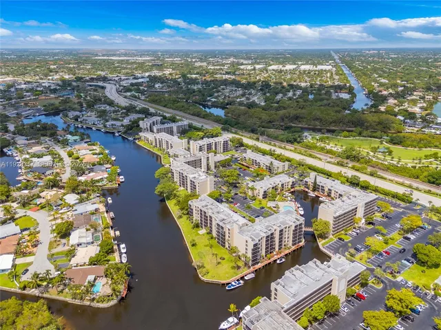 a swimming pool with outdoor seating and yard