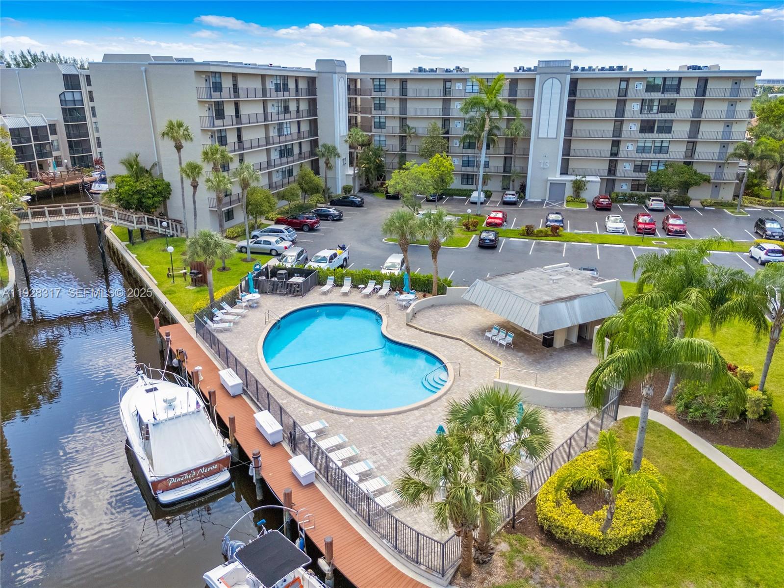 12 Royal Palm Way, Unit 103 Boca Raton, FL 33432 - Photo 26 of 29 a view of a swimming pool with outdoor seating