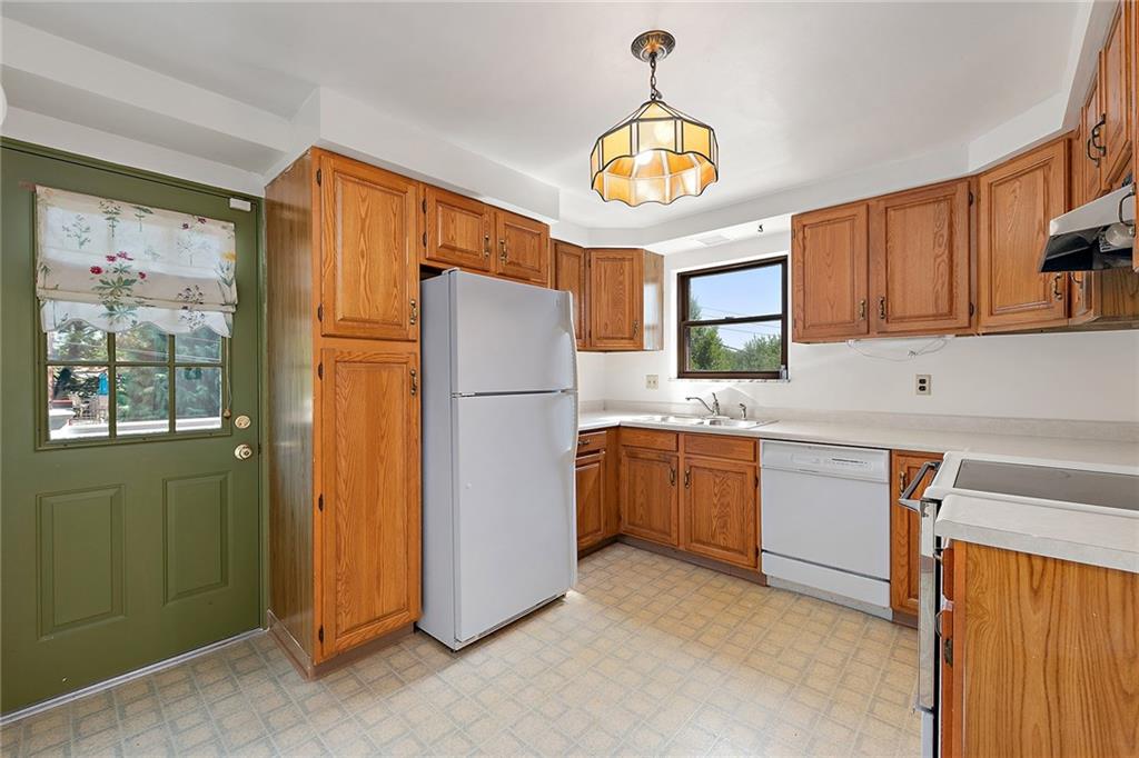 335 Twin Oaks Road Pittsburgh, PA 15243 - Photo 8 of 24 The kitchen is spacious and well laid out for ease of cooking. A small side porch, perfect for a grill is accessible from the exterior door.