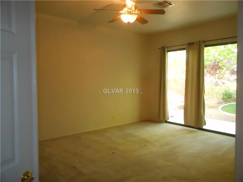 4716 Monument Valley Road Las Vegas, NV 89129 - Photo 11 of 31 Property Photo. Master bedroom with access to park like rear yard.