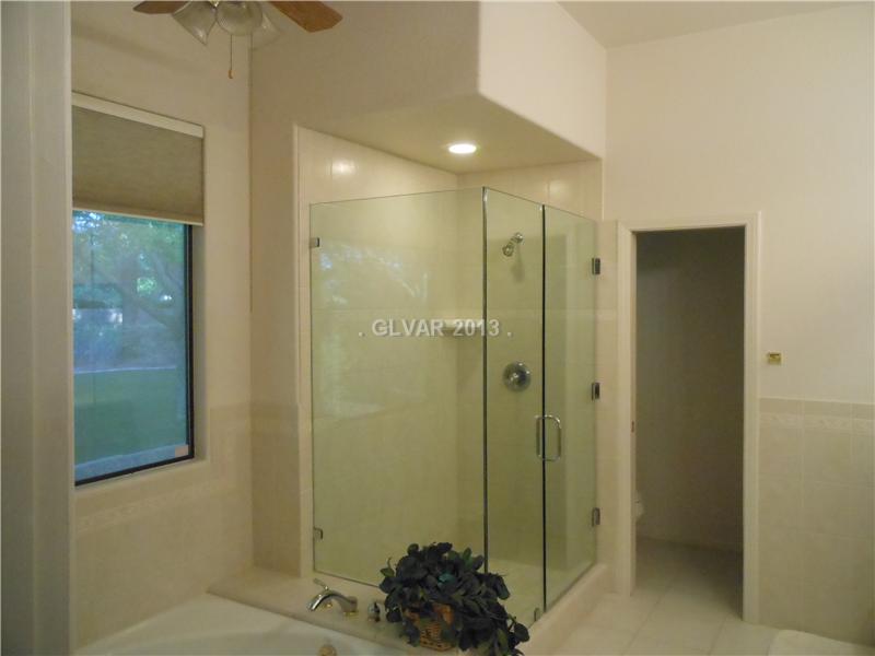 4716 Monument Valley Road Las Vegas, NV 89129 - Photo 14 of 31 Property Photo. Frameless master shower enclosure.