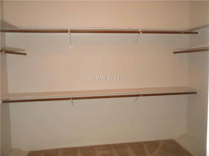 4716 Monument Valley Road Las Vegas, NV 89129 - Photo 16 of 31 Property Photo. Master bedroom spacious walk in closet.