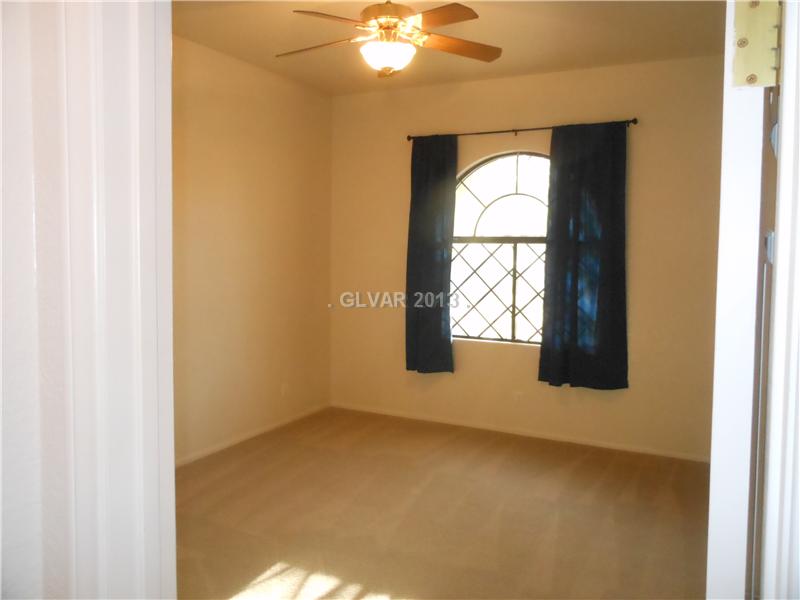 4716 Monument Valley Road Las Vegas, NV 89129 - Photo 17 of 31 Property Photo. Large bed 2 with ceiling fan.