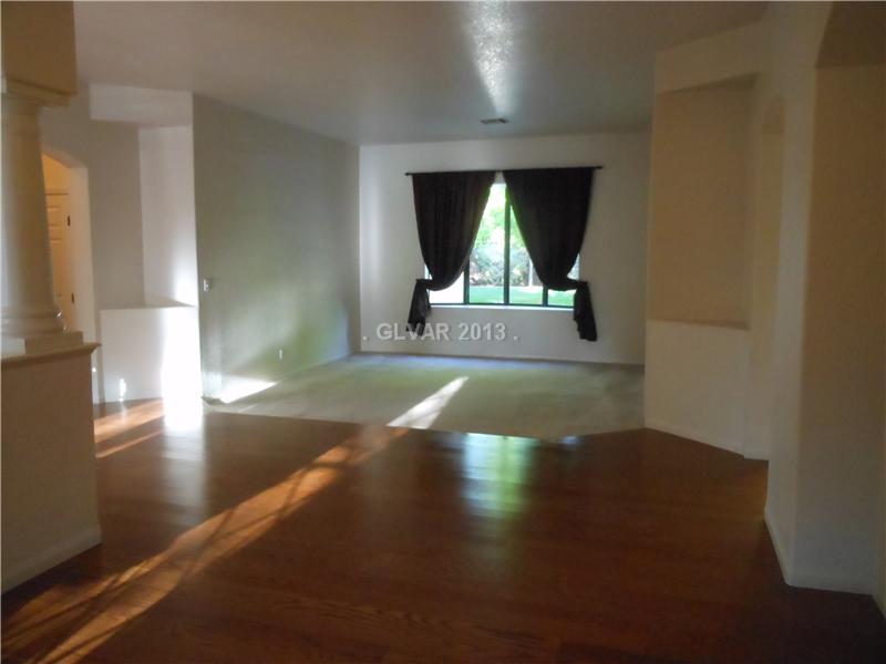 4716 Monument Valley Road Las Vegas, NV 89129 - Photo 2 of 31 Property Photo. Entry with new hardwood floors to formal living room.