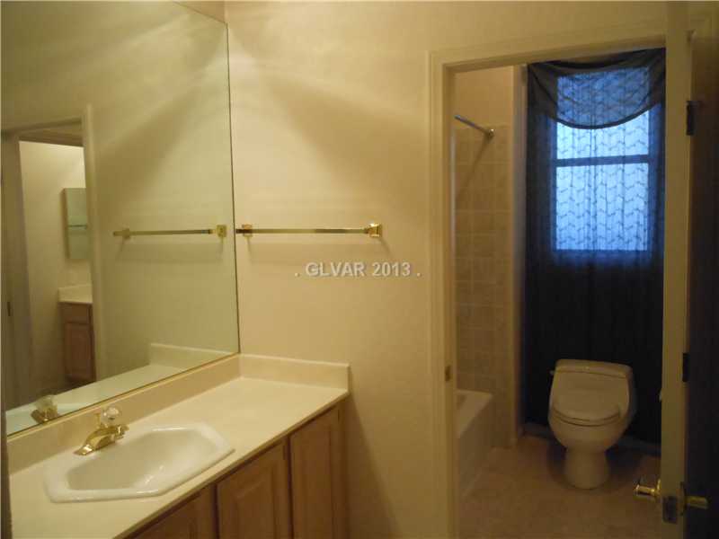 4716 Monument Valley Road Las Vegas, NV 89129 - Photo 20 of 31 Property Photo. Jack and Jill bath shared with bedrooms 2 and 3.